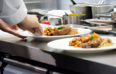 Chef preparing food, meal, in the kitchen, chef cooking, Chef decorating dish, closeup, .Chef preparing food, meal, in the kitchen, chef cooking, Chef decorating dish, closeup, .