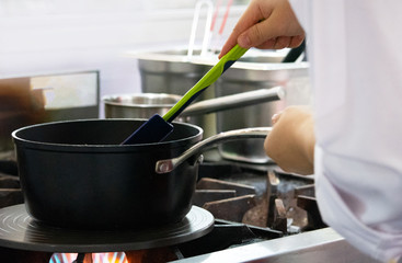 Chef preparing food, meal, in the kitchen, chef cooking, Chef decorating dish, closeup, .Chef preparing food, meal, in the kitchen, chef cooking, Chef decorating dish, closeup, .