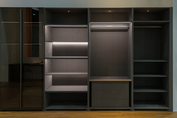 Modern brown empty wooden wall cabinet shelf interior with diffuse lighting in living room...