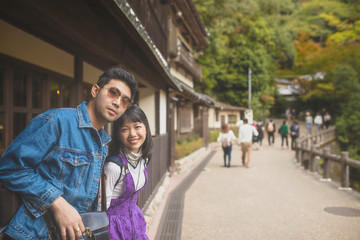 younger asian man and woman traveling with happiness in japan destination