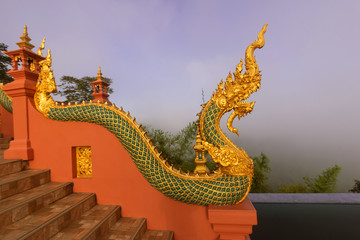 Beautiful Naga statue and arched entrance In the morning Before sunrisenat Wat Doi Phra Chan in...