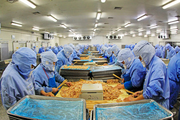 Workers in a meat processing production line, in a food processing enterprise, tangshan city, hebei...