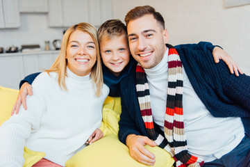 Fototapeta premium loving parents and son looking at camera