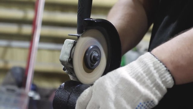 locksmith saws pipe with circular saw. close-up
