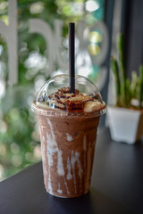 Chocolate smoothie (milkshake) with jar in cafe