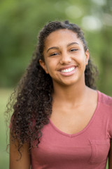 Young happy teen girl laughing and smiling.