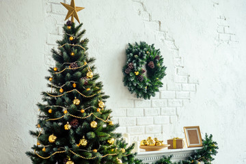 close up copyspace composition of christmas studio room with fireplace and new year tree.Christmas Eve and New Year's morning,magic and sorcery copy space