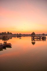Amazing panoramic view of Gadisar or Gadi Sagar Lake with the view of historical building and temple during sunrise in Jaisalmer, India.