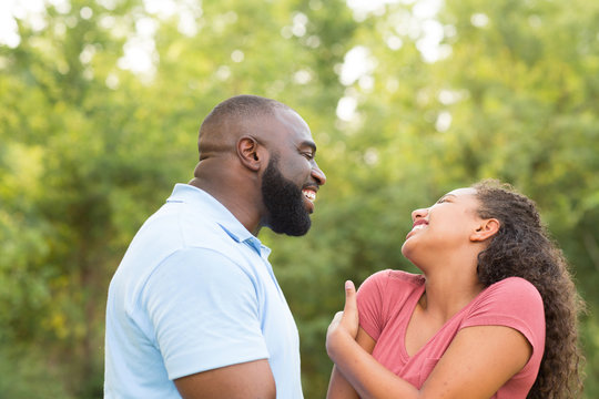Father and his son laughing and playing at the park. - Powered by Adobe