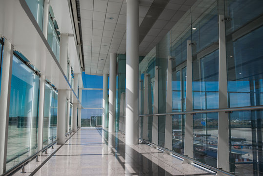 Empty Airport Hall with Glass Windows and White Column.