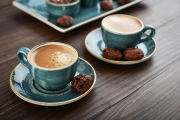 Two cup of coffee and with chocolate cookies