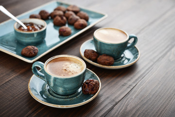 Two cup of coffee and with chocolate cookies