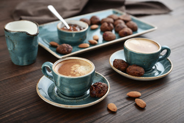 Two cup of coffee and with chocolate cookies