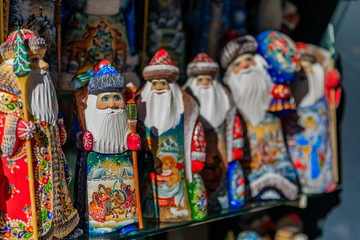 Fototapeta na wymiar Christmas ornaments of Russian Santa Claus or Ded Moroz (Grandfather Frost) on display for sale in a souvenir shop in Saint Petersburg Russia