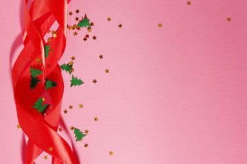 Red ribbon and confetti New year background with copy space