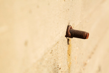 tighten bolts rust on concrete walls