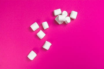 marshmallows on a pink background. top view