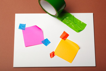 sellotape, scotch, painter and duct tape on a paper background