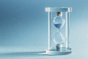 Hourglass on blue background