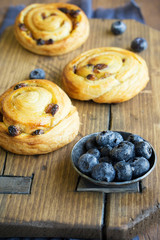fresh blueberry and berry buns on desk