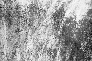 Сraked weathered cement wall texture in black and white.