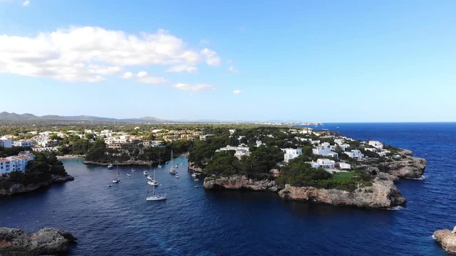 Flight over the bay of Cala D'or and Cala Ferrera in Mallorca