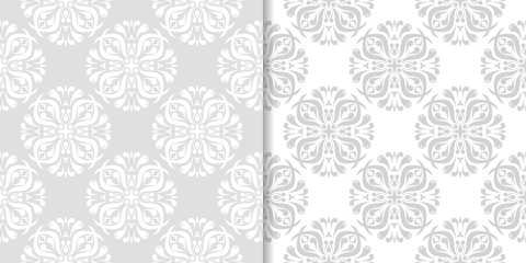 Light gray floral backgrounds. Set of seamless patterns