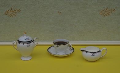 English teacup with saucer, sugar bowl and cream jug, fine bone china porcelain