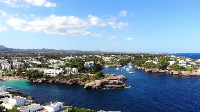 Flight over the bay of Cala D'or and Cala Ferrera in Mallorca