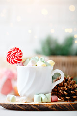 Merry Christmas and happy New year. Cup of cocoa and marshmallows on a light background. Selective focus. Christmas background.