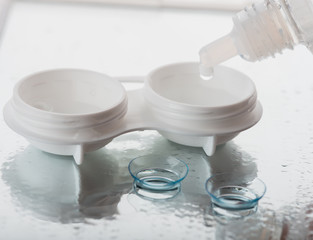 Bottle with lens solution and case