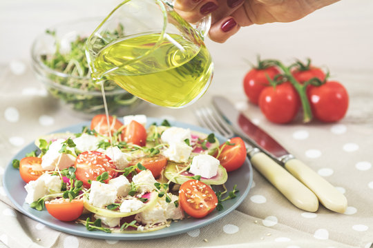 Healthy delicious tasty salad dressed with olive oil