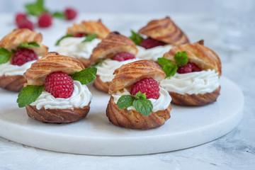 Raspberries Profiteroles with White Chocolate cream