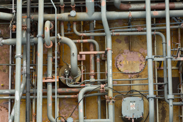Rusty pipes of cargo system of the oil product tanker.