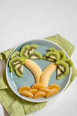 fruit salad for kids, kiwi banana mandarin palm trees