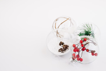 Obraz na płótnie Canvas Christmas balls decorations on white background. Closeup Selective focus Christmas balls. Christmas frame with copy space.