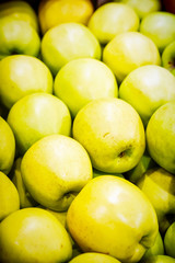many fresh raw green apples as background