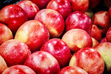 many fresh raw red apples as background