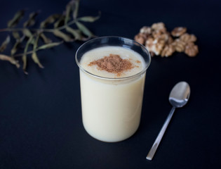 Traditional Turkish drink consumed frequently during winter months Boza or Bosa. Black background.