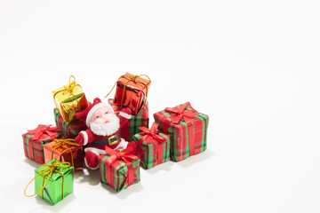 Santa claus doll with gift box isolated white background.