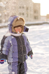 Boy enjoying the first snow