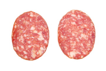 Salami sausage slices isolated on white background, top view