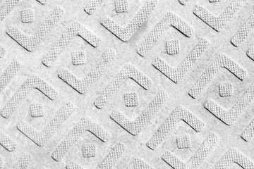 Steel sheet with pattern notches - gray vintage metal abstract light coloured black and white...
