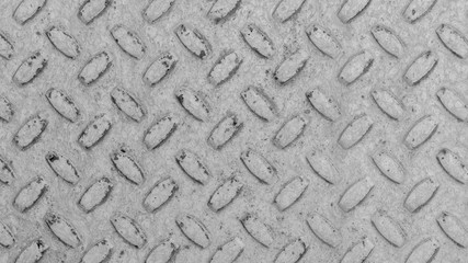 Steel sheet with notches - gray vintage metal abstract light coloured black and white background, texture close-up