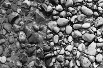 gravel with water texture natural abstract black and white background close-up