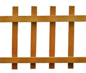 A simple wooden fence of green color against the background of grass in the country