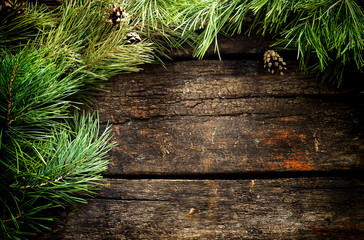 Vintage  Christmas holiday wooden planks rural background. Beautiful Empty Christmas Backdrop decorated with snow.  New Year Background.  Xmas background with pine branches