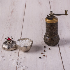 Salt and Pepper on wooden table.
