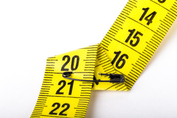 Measuring tape of the tailor for you design. On white background