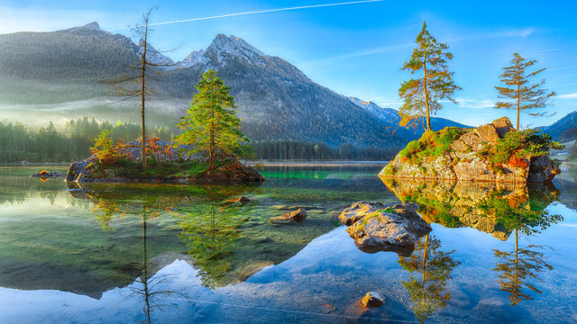 Fantastic autumn sunrise of Hintersee lake. Classic postcard view of Hintersee